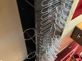 a rack of wine glasses and wine glasses in a wine bar