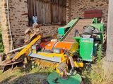a tractor that is parked next to a building