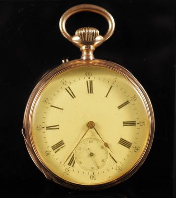 a gold pocket watch with roman numerals on it
