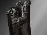 statue of a woman holding a bird in her hands