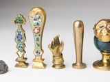 many different types of figurines displayed on a table