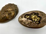 pair of antique brass buttons with a lion head on them