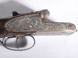 an old gun that is sitting on top of a table