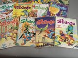 a lot of comic books that are on the table
