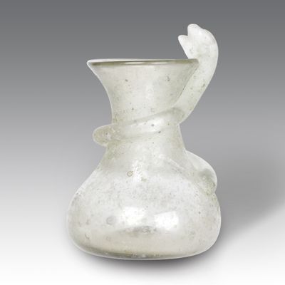 a white glass vase with a bird on it