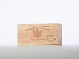 a wooden box with a label on it sitting on top of a table