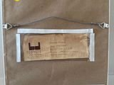 a picture of a brown paper bag with a label on it