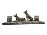 statue of a dog and a cat on a marble base
