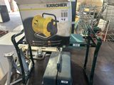 a box with a hose sitting on top of a cart