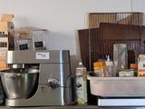 a kitchen with a bunch of appliances on the counter