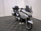 a motorcycle that is parked on a black and white checkered floor