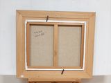 a picture of an easel with a picture on it
