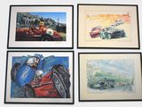 four framed pictures of racing cars on display in a room