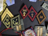 many different types of badges on a table