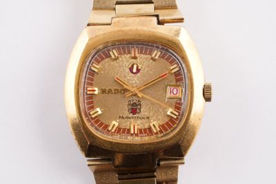 an image of a close up of a wrist watch on a white surface