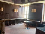 a room with a lot of windows and a ceiling painted with stained glass