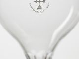 a wine glass that has a bird on it