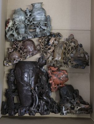 a box filled with different types of sculptures in it