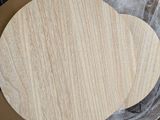 a wooden cutting board sitting on top of a piece of paper