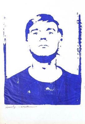 blue and white photograph of a man in a blue shirt