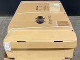 a box with a skull and crossbone on it sitting on a carton