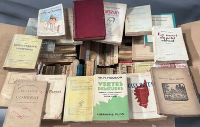 a lot of books that are sitting on a table