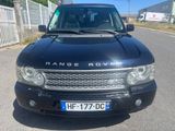 a picture of a black range rover parked on the side of the road