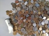 a lot of coins that are sitting on a table