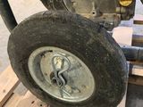 a close up of a wheel on a pallet in a warehouse