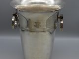 an antique silver plated ice bucket with handles and handles