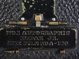 a close up of a black leather case with a clock on it