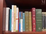 many books that are on a book shelf together