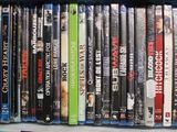 many dvds in a plastic case on a table