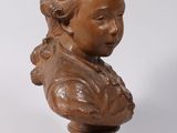 a small statue of a woman on a pedestal