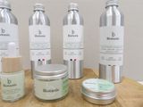 several different types of skin care products on a wooden table