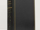 a black book with gold trim and a gold star on the cover