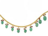 un collier en or serti d'émeraudes et de rubis