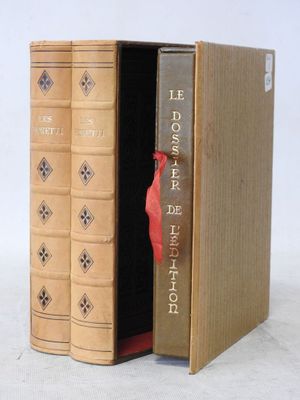 two books that are open to show a red bird