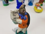 a statue of a man holding a sign in his hand