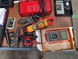 a box full of electrical tools on a table