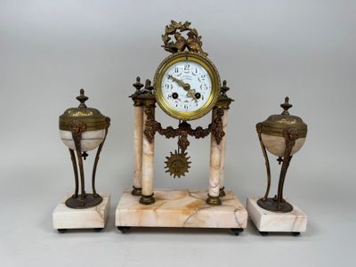 a clock that is sitting on top of a marble stand