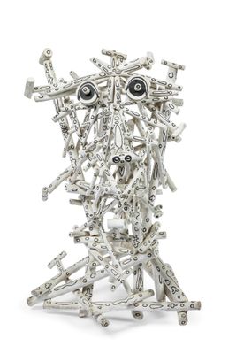 a metal sculpture of a face made out of tools