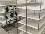 a white shelving with lots of white items on it