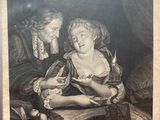 an old black and white photo of a woman holding a child