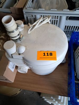 a white toilet sitting on top of a wooden table