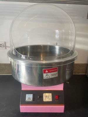 a machine that is sitting on a counter with a glass dome on top of it