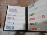a book with stamps on it sitting on a table