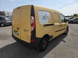 a yellow van that is parked in a parking lot
