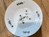 a close up of a small bowl on a wooden table