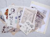 a pile of old postcards on a table